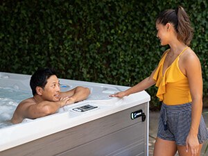 hot-spring-spas-all-collection-pages-hspot-lifestyle-couple-near-spa